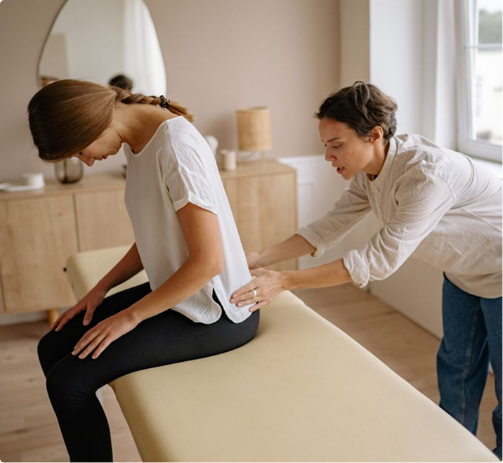 combination-img Physician examining a seated patient during a combination pelvic venous disease treatment consultation