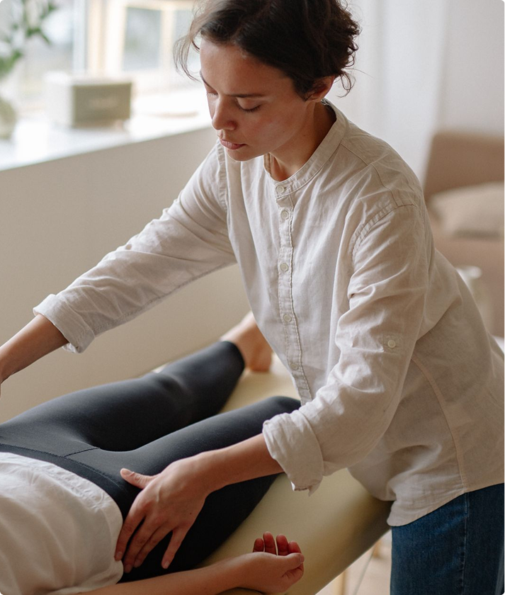 recovery-img Woman resting on the edge of a bed at home while recovering after a minimally invasive procedure